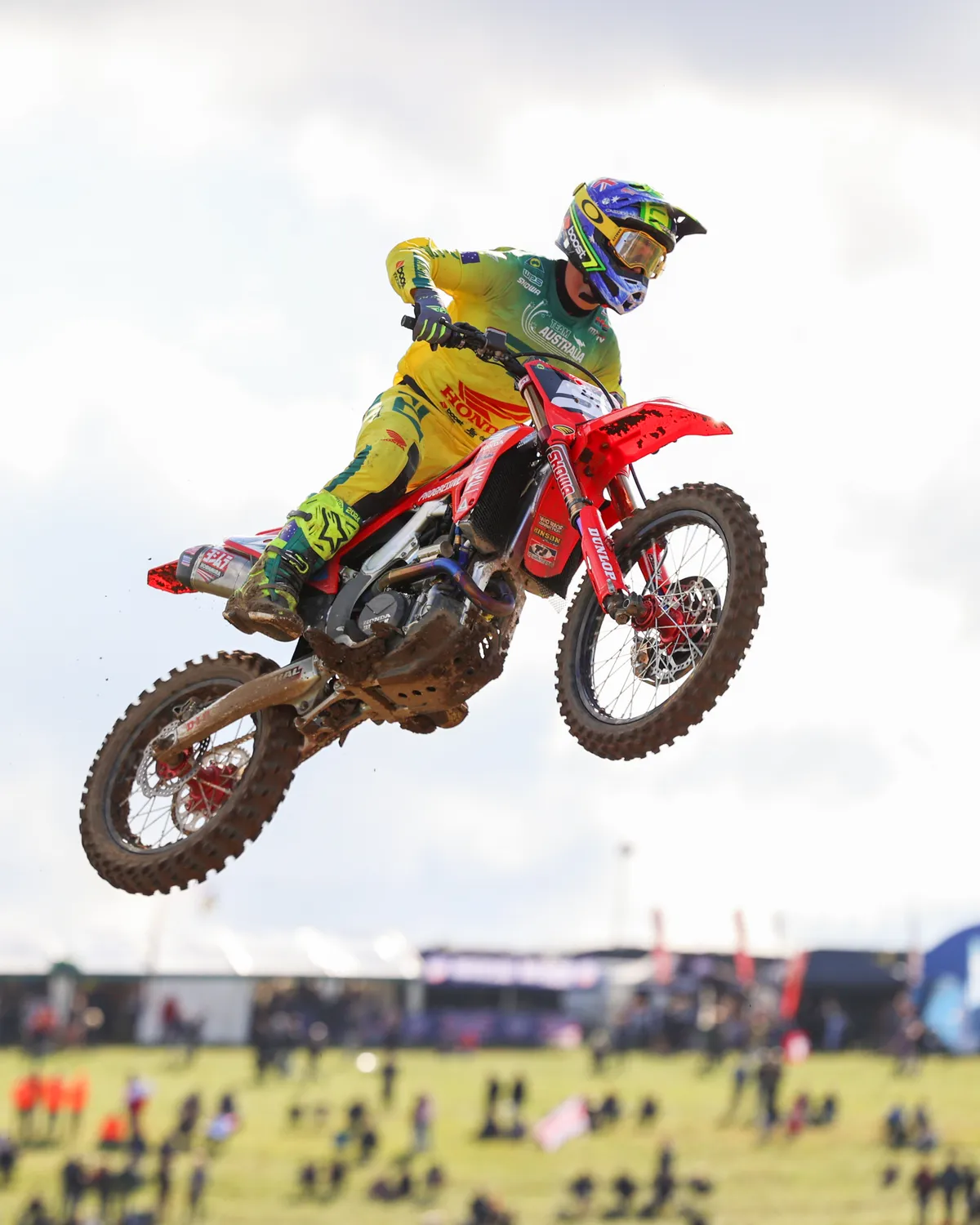 Motocross rider in Australian colours flying high above the crowd at the Motocross of Nations