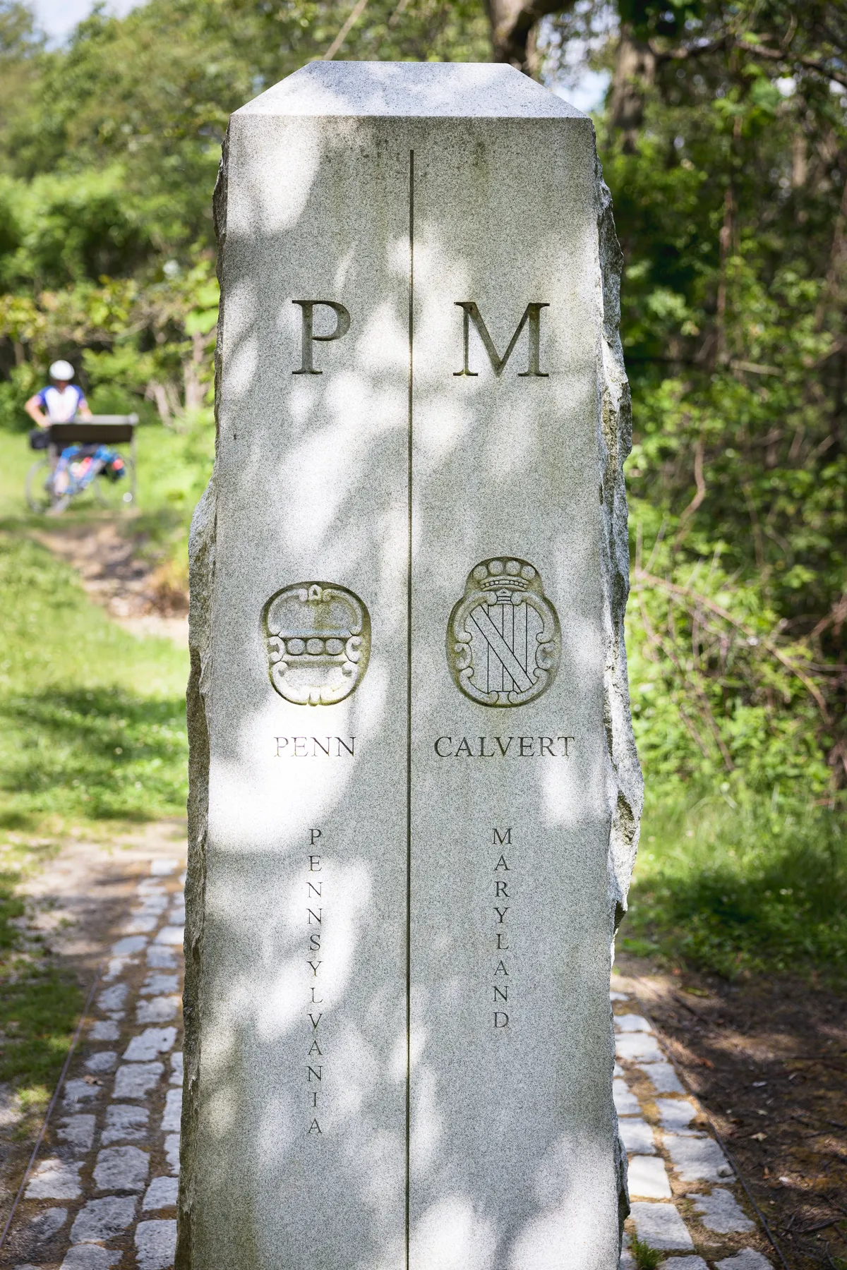Mason-Dixon stone marker carved with the Penn and Calvert crests