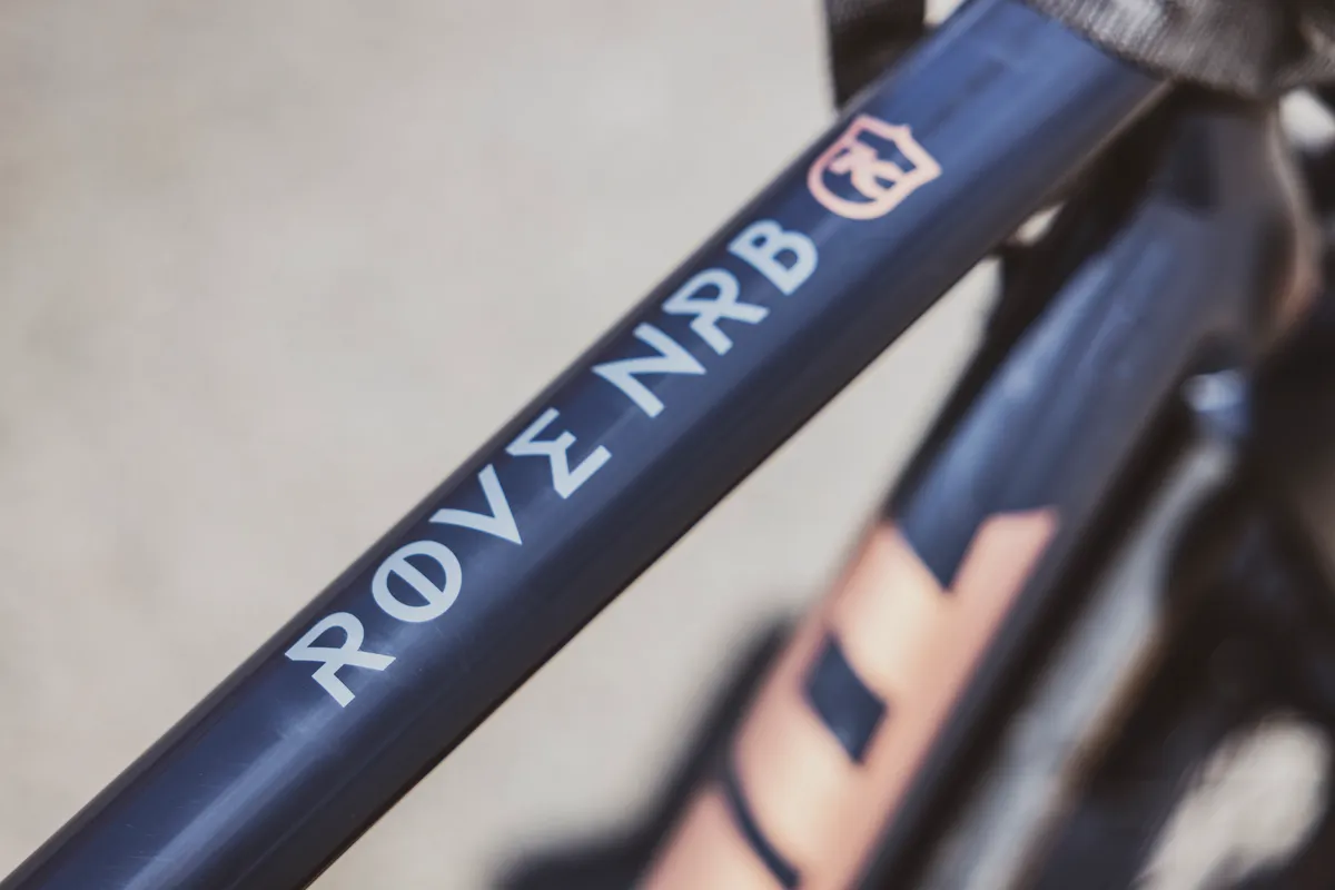Close-up of the ROVE NRB lettering on the bike's top tube