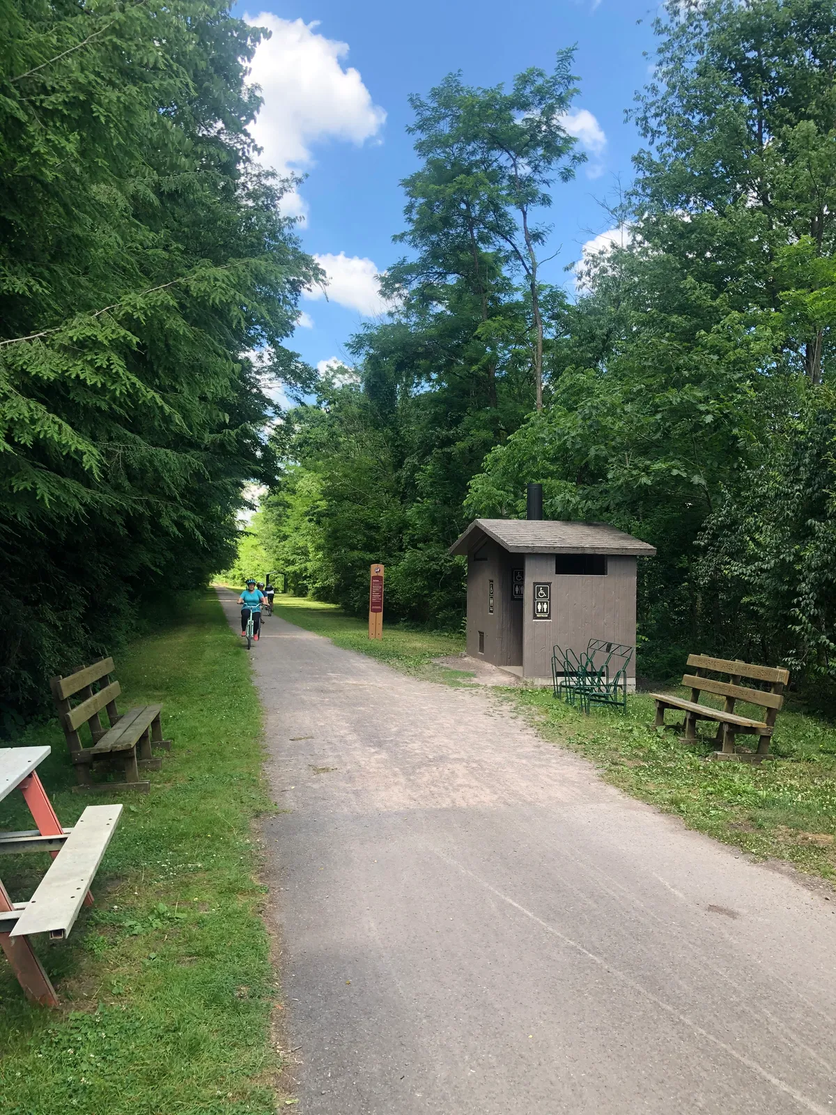 Trailside restroom building with benches
