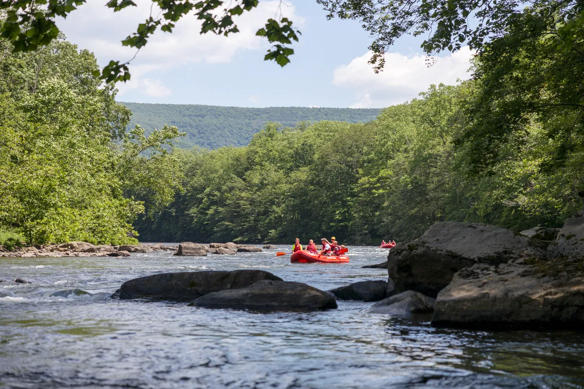 Red rafts running the Youghiogheny between boulders