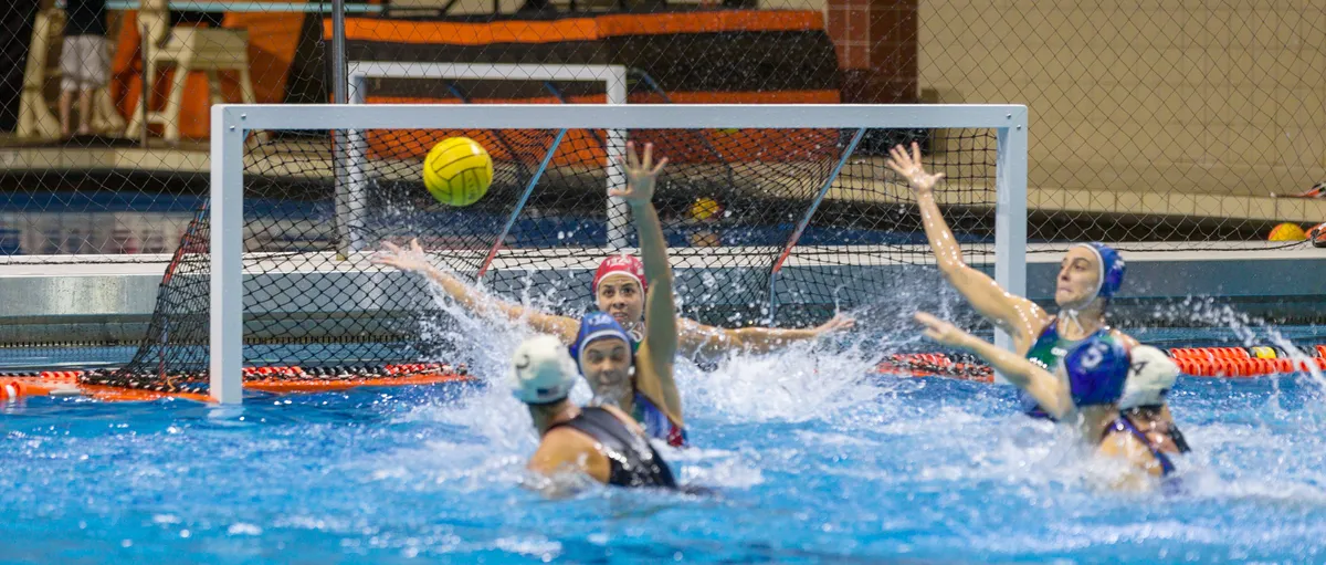 USA shot flying into the open net as Italy's goalkeeper and defenders lunge