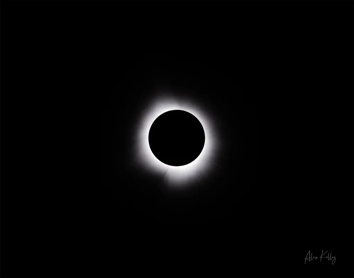 Glowing corona around the eclipsed sun