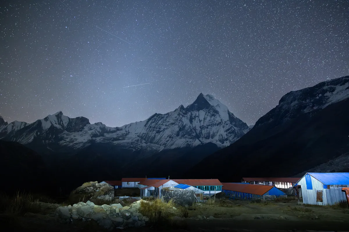 Stars over the Annapurna range above a mountain lodge